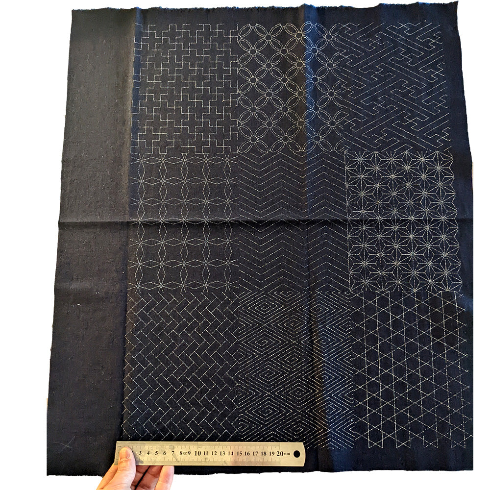 Sashiko fabric with Keiko design pattern showcasing 9 traditional geometric patterns, ideal for creating authentic and unique textiles.