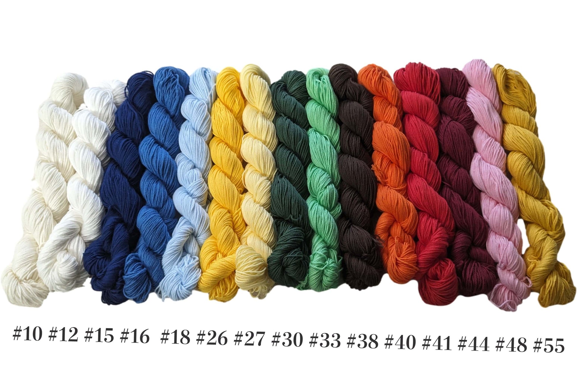 Variety of Traditional Sashiko Mono Color Threads in different shades and colors laid out in a row.